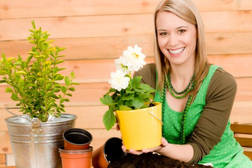 Supervisor reviewing safe work practices during a gardening service